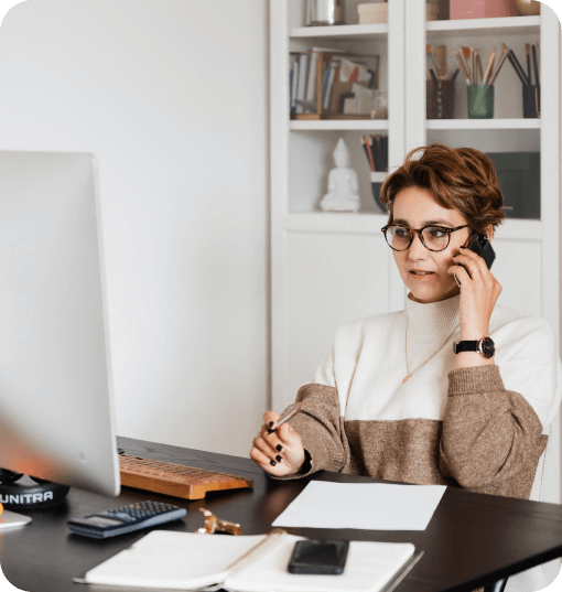 Woman on the phone at her desk