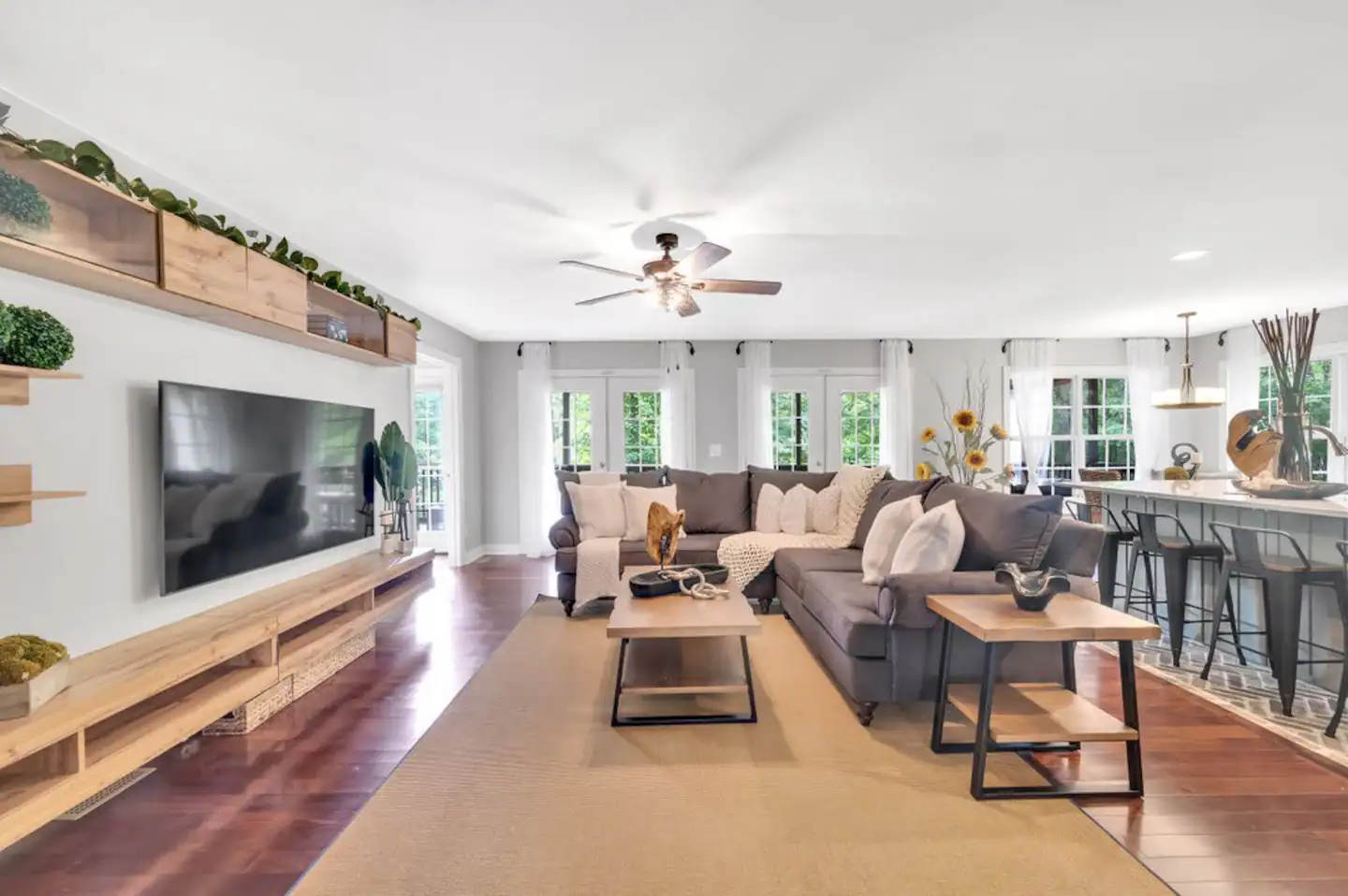 Living room with 75" HD TV and WIFI. Floating TV Entertainment Stand