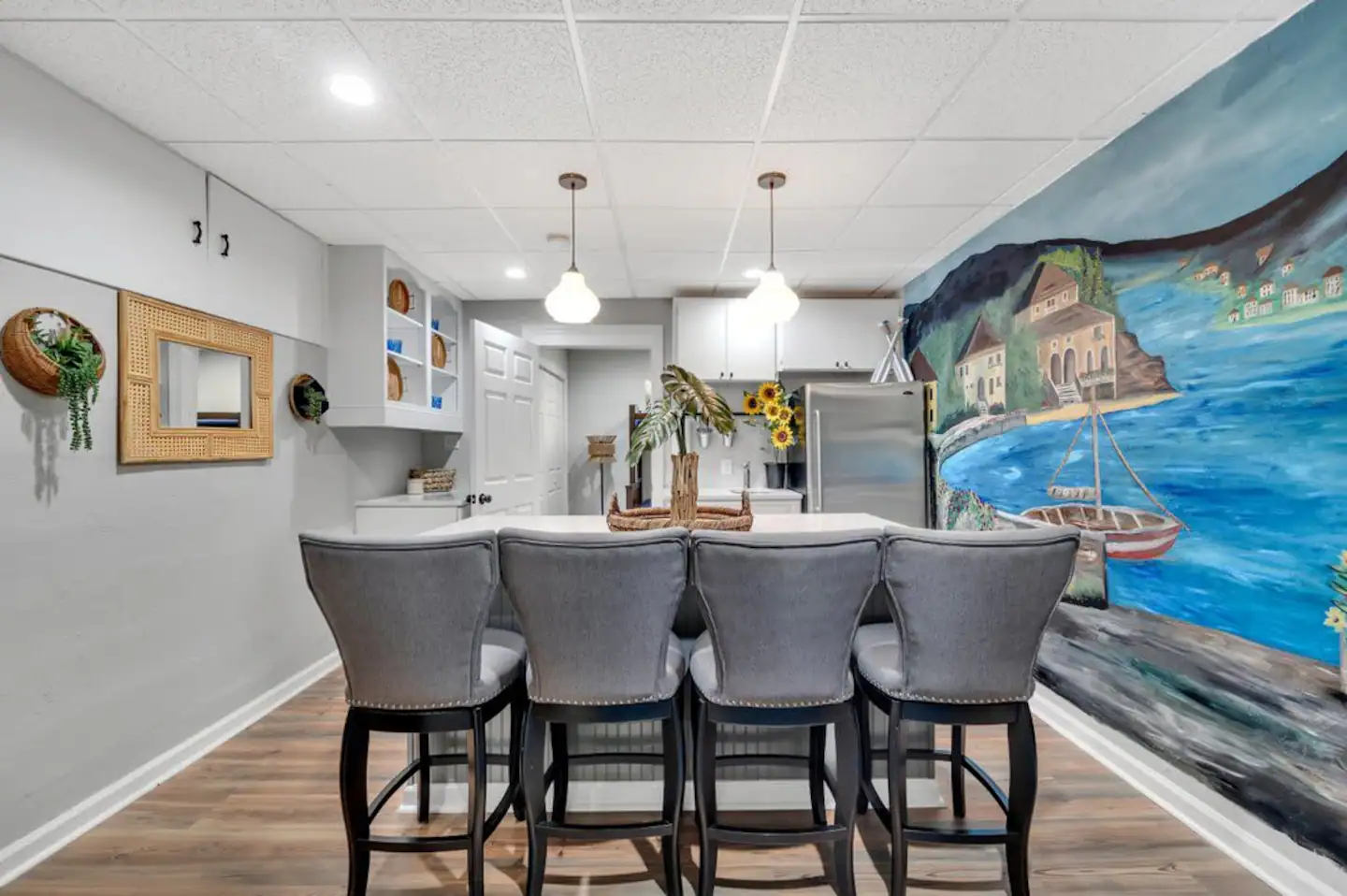 4 barstools at the counter. Hand painted local artist of Tuscan Lake side.