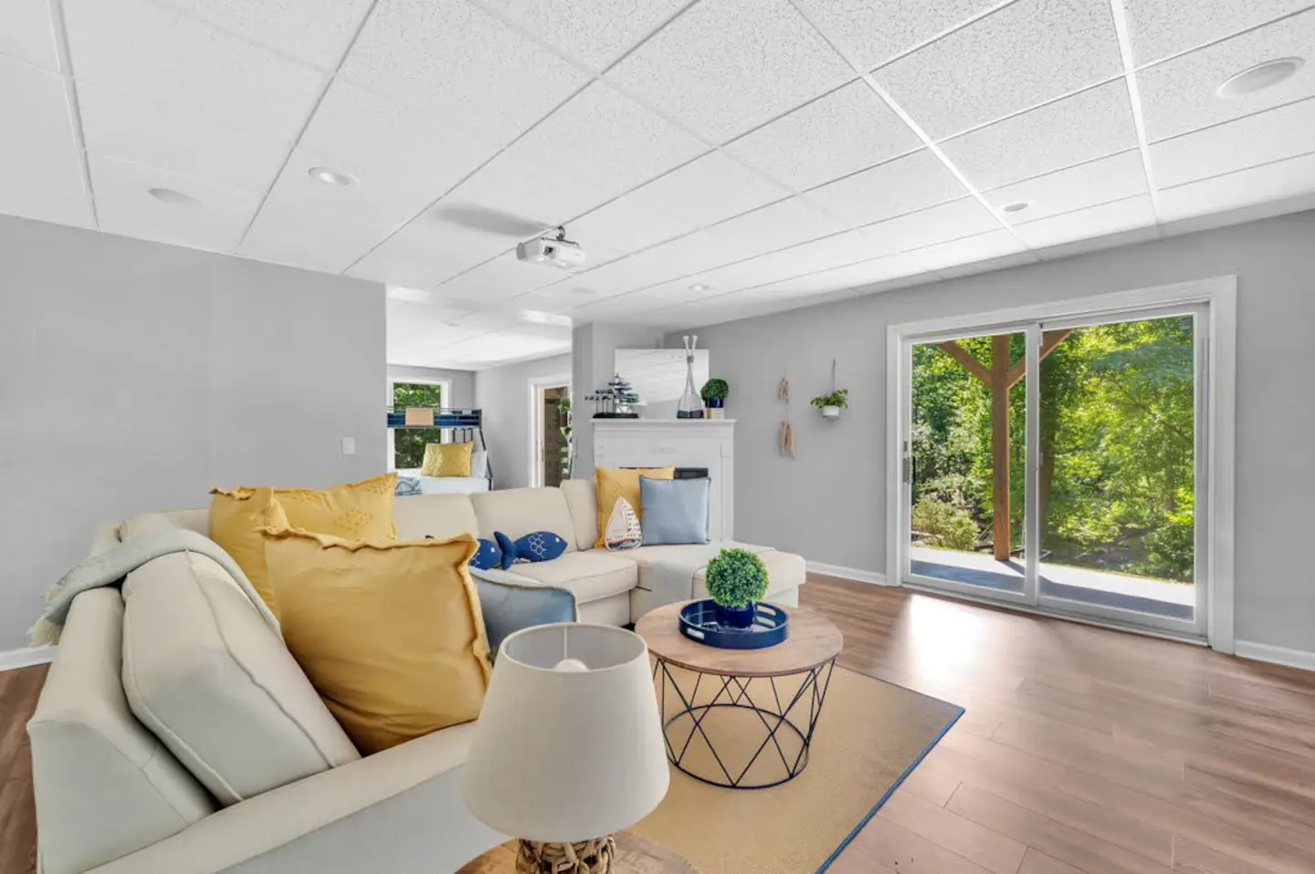 2nd living room Entertainment System, 85" HD TV and owners installed surround sound entertainment system.