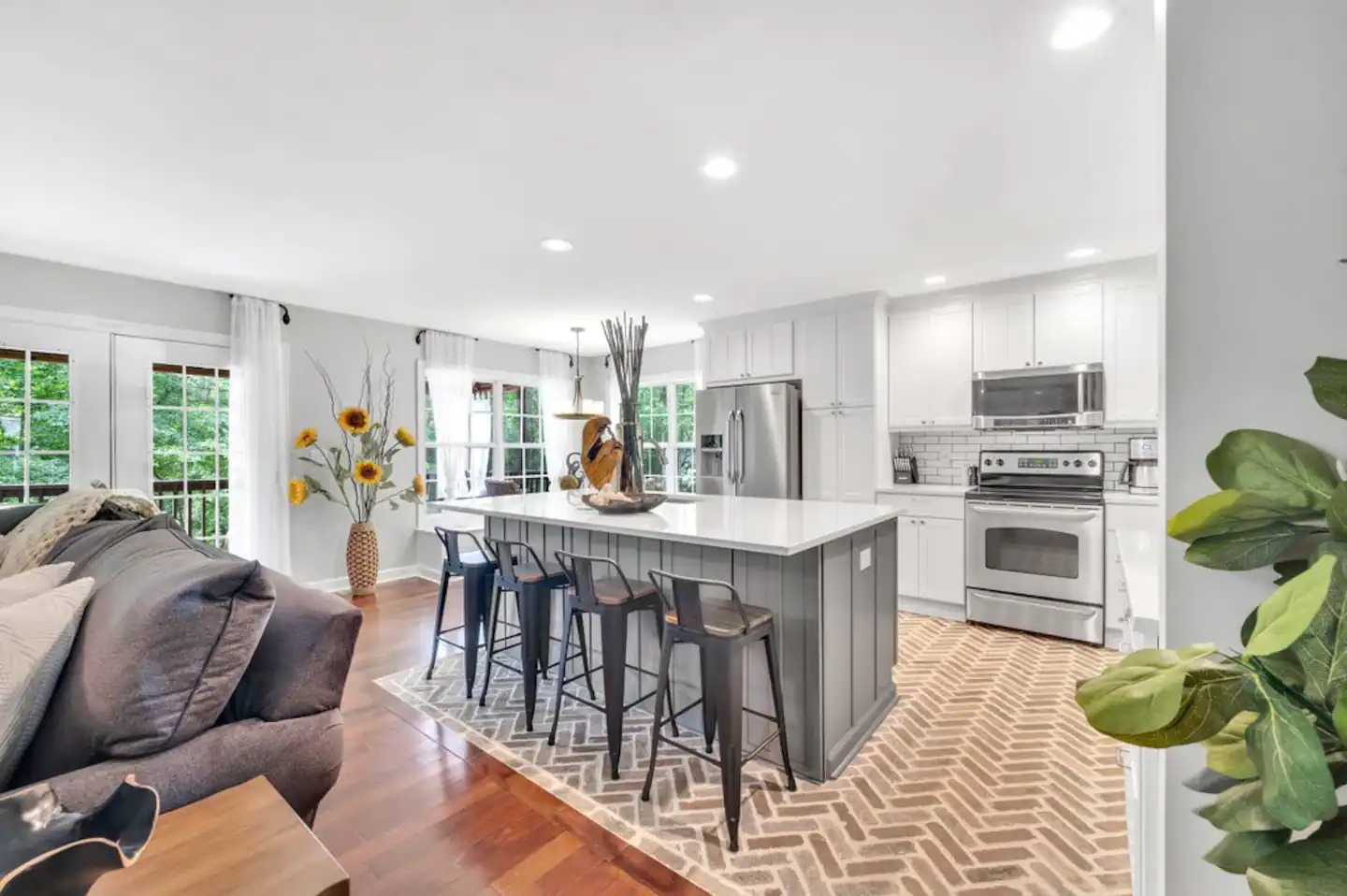 Fully loaded kitchen with cooking essentials and pots pans and flatware, glassware, and flatware!