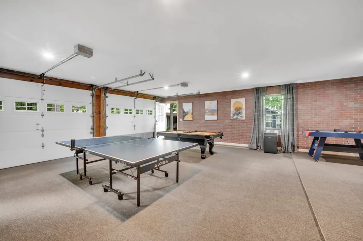 GAME ROOM (unattached from home) See app for code and remote access. Ping pong, pool table, air hockey, bball, darts & more!!
