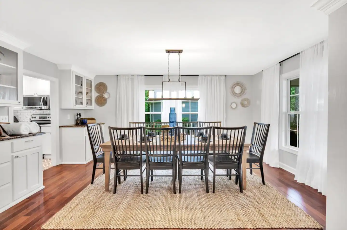 Dining Room Seating for 12, Wine glasses and table place mat settings in cabinets
